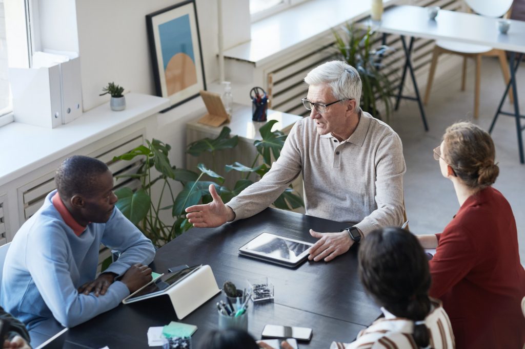 Senior Business Leader in Meeting